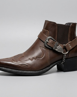 Close-up of the buckle strap and pointed toe on a men's vintage western boot