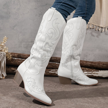 Knee-high cowboy boots shown from a three-quarter angle highlighting embroidery