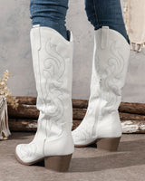 Knee-high western cowboy boots with embroidered shaft and block heel, pointed toe, front view