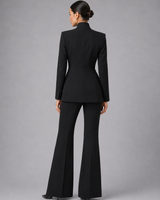 Side profile showing the wide-leg silhouette and full-length trouser hem