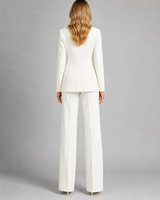 Side view showing the wide-leg silhouette and blazer structure