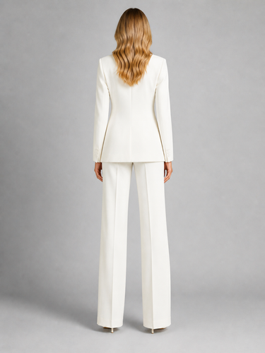 Side view showing the wide-leg silhouette and blazer structure