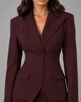 Side view showing the wide leg silhouette of the tailored trousers