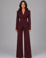 Front view of a three-piece tailored set with wide leg trousers and a peaked lapel blazer