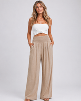 Close-up of the smocked high-rise waistband and pull-on design