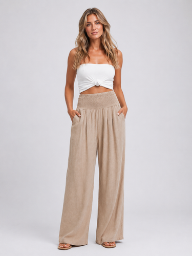 Close-up of the smocked high-rise waistband and pull-on design