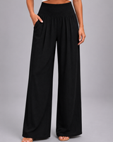Close-up of front pleat detailing on the wide leg trousers
