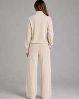 Close-up of the half-zip closure and high stand collar on the sweatshirt
