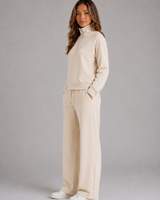Side view of the wide leg trousers showing the relaxed fit and drape