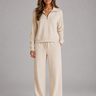 Front view of the two-piece co-ord set showing the half-zip sweatshirt and wide leg trousers