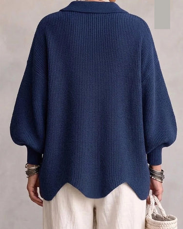 Side view showing the full-length sleeves and hip-length silhouette of the cardigan