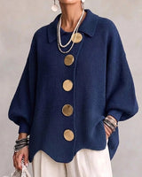 Front view of a hip-length collared cardigan with large metallic buttons and lapel collar