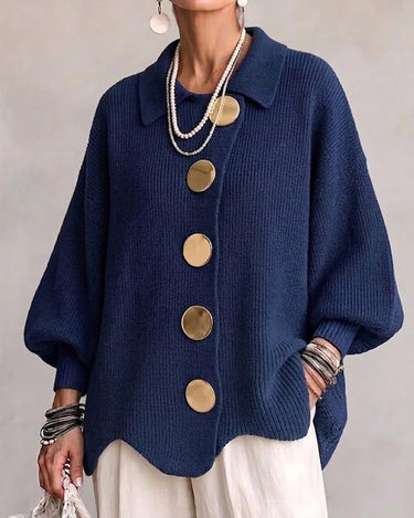 Front view of a hip-length collared cardigan with large metallic buttons and lapel collar