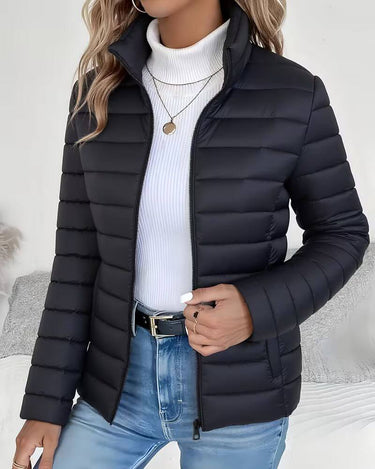 Side profile showing hip-length silhouette and quilted outer shell