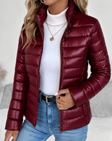 Flat lay of cropped puffer jacket showing overall shape and quilting