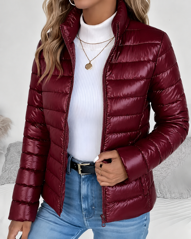 Flat lay of cropped puffer jacket showing overall shape and quilting