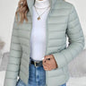 Front view of cropped puffer jacket with stand collar and zip closure