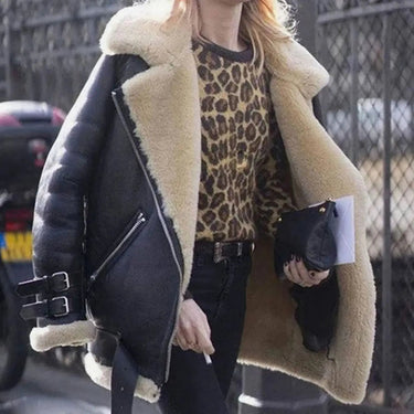Back view of oversized faux leather jacket with faux fur lining visible at collar