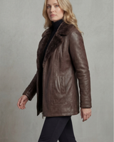 Close-up of the faux shearling lapel collar and gunmetal zip on a faux leather jacket