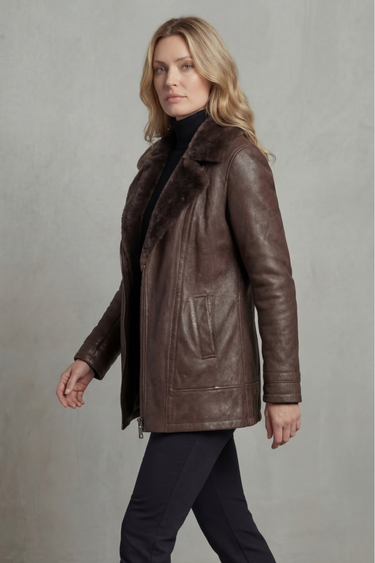 Close-up of the faux shearling lapel collar and gunmetal zip on a faux leather jacket
