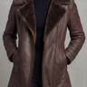 Woman wearing a faux leather jacket with an oversized shearling lapel collar and full-length zip