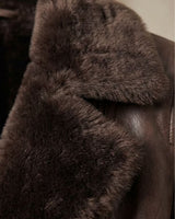 Back view of a women's faux leather jacket with a structured silhouette