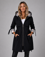 Close-up of the front zip closure and hood on a longline hooded jacket