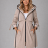 Woman wearing a longline hooded jacket with front zip and drawstring waist, front view