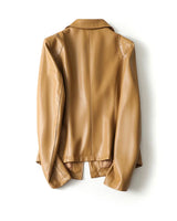 Side view of the leather blazer showing welt pocket and structured silhouette