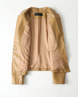 Close-up of the single-button front fastening on the leather blazer