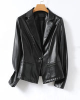 Detail shot of the notched lapels on the tailored leather blazer
