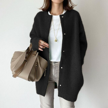 Side profile showing the longline silhouette and hem length