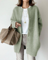 Model wearing the longline cardigan layered over a top