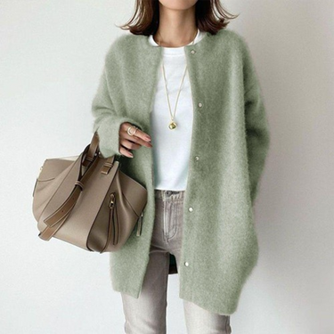 Model wearing the longline cardigan layered over a top