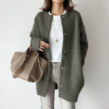 Three-quarter view showing the button closure and overall length