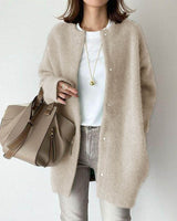 Flat lay of the longline cardigan showing the full front detail