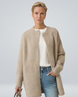 Front view of a longline button-front cardigan worn by a model