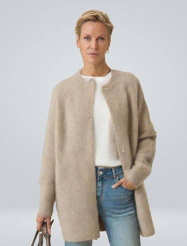 Front view of a longline button-front cardigan worn by a model