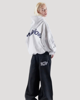 Close-up of drawstring hood on graphic oversized hoodie