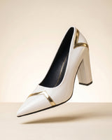 Front view of ankle boot highlighting the V-shaped metallic trim detail