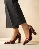 Three-quarter view of the high-shine patent-finish ankle boot