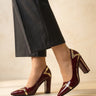 Three-quarter view of the high-shine patent-finish ankle boot
