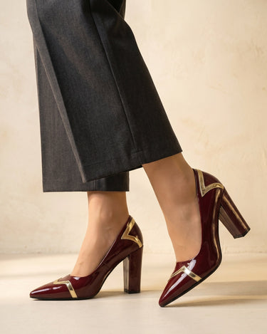 Three-quarter view of the high-shine patent-finish ankle boot