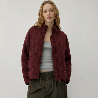 Back view of quilted jacket showing overall silhouette and hem length
