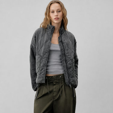 Front view of quilted puffer jacket with high stand collar and patch pockets