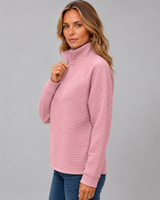 Close-up of half-zip neckline detail on ribbed knit jumper