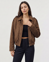 Detail of the hem elastication on a faux suede bomber jacket