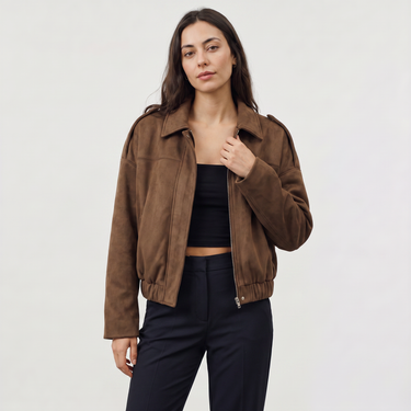 Detail of the hem elastication on a faux suede bomber jacket