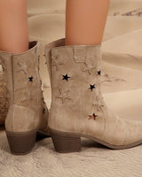 Side view of mid-calf western boots showing punched star shapes on the shaft