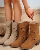 Front view of suede cowboy boots with block heel and star cut-out detailing